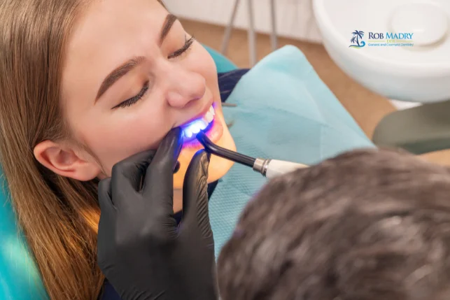 Dental bonding cost and treatment with a curing light at Rob Madry DDS in Corpus Christi